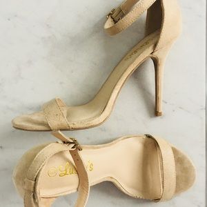 Faux suede nude heels with ankle strap.